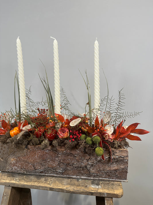 Autumnal dried everlasting arrangement in wooden trough